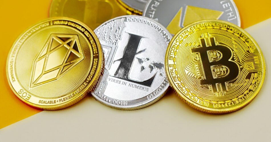 Crypto payment coins on yellow background