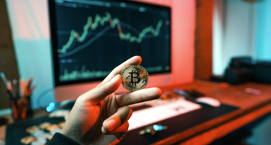 Bitcoin in front of a screen